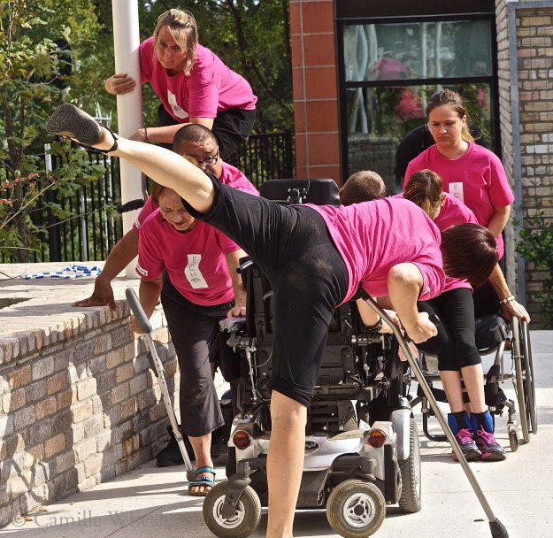 On the move: Choreographer Silva Laukkanen (foreground) and Body Shift dancers Susie Angel (in wheelchair), Peggy Lamb, Juan Munoz, and Donna Woods (at left, front to back), Tanya Winters (head down, beside Angel) and Ashley Card (back right) build a statue during their ECHO performance on Sept. 27, 2015, at the Center for Creative Action in East Austin. 
